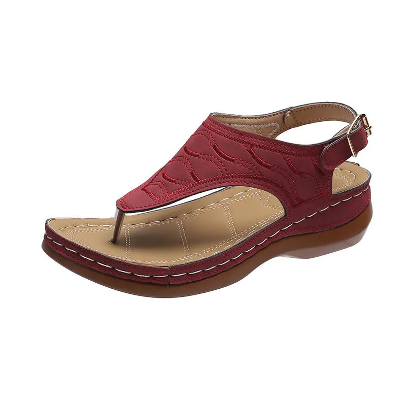 Women's black casual wedge heel sandals with an adjustable buckle strap on ankle.