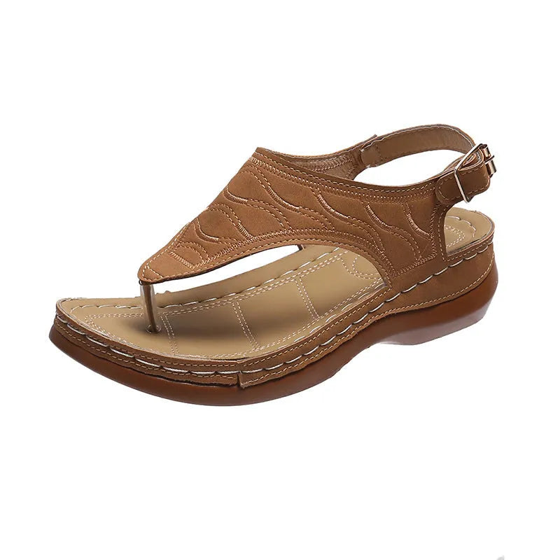 Women's black casual wedge heel sandals with an adjustable buckle strap on ankle.