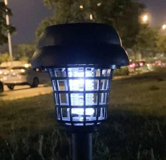 Solar-powered outdoor mosquito killer lamp with white and purple LED lights, IP65 rated for garden use.
