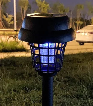 Solar-powered outdoor mosquito killer lamp with white and purple LED lights, IP65 rated for garden use.