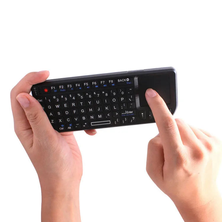 Mini wireless Bluetooth laser touch keyboard flying squirrel with 7-colour backlight, black ABS casing, 69 keys