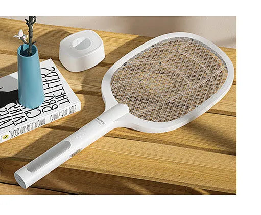 Rechargeable handheld electric mosquito swatter with a safety net, USB charging cable, and charger base.