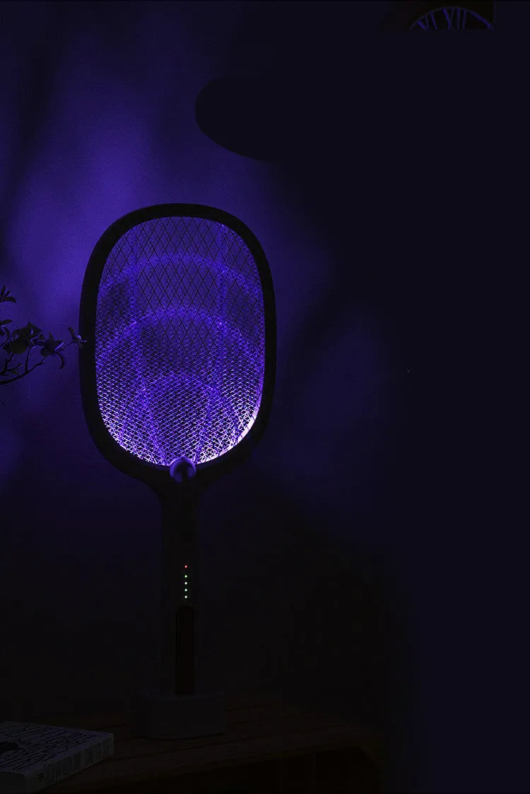 Rechargeable handheld electric mosquito swatter with a safety net, USB charging cable, and charger base.