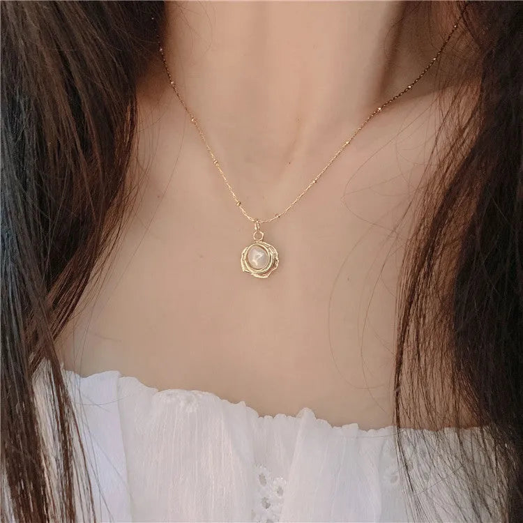 Golden freshwater pearl necklace with titanium steel element in a retro baroque style, single necklace