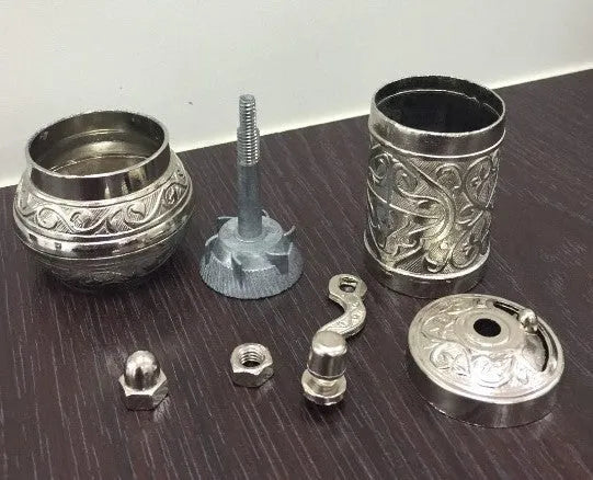 Small Turkish manual coffee grinder in silver with removable hand crank and ceramic burr