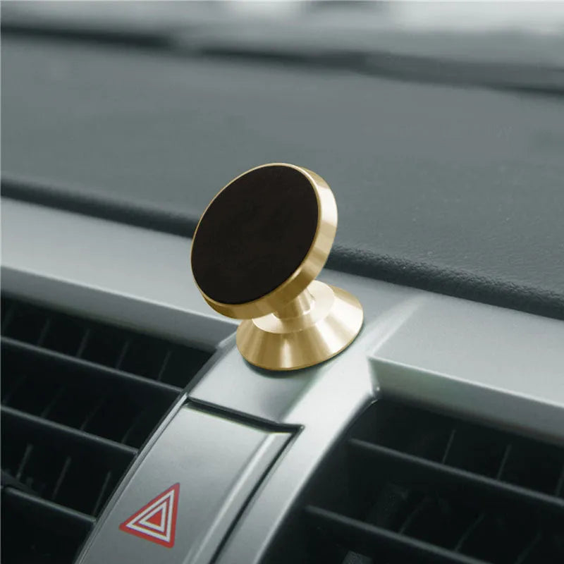 Universal magnetic car phone holder showing black, silver and gold colour options