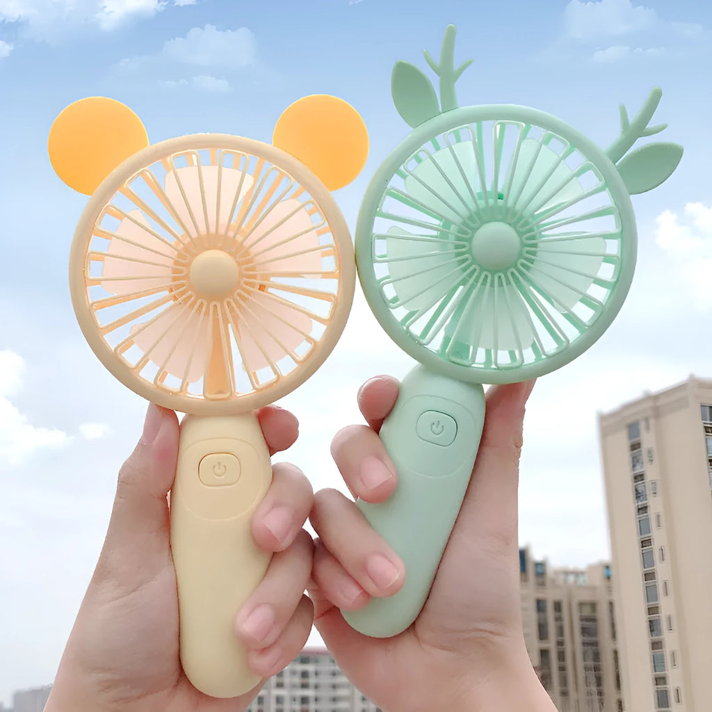 Blue hand-held USB charging mini fan with plastic blades on a white background.