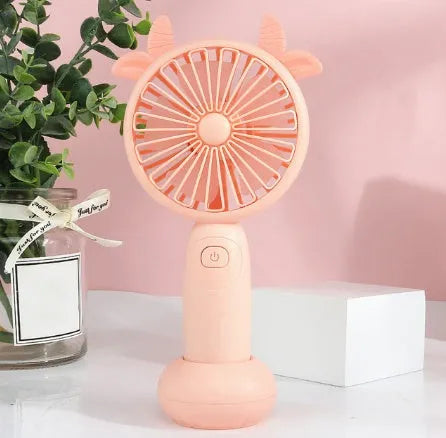 Blue hand-held USB charging mini fan with plastic blades on a white background.