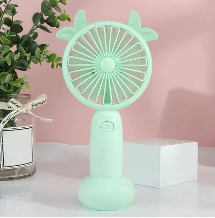 Blue hand-held USB charging mini fan with plastic blades on a white background.