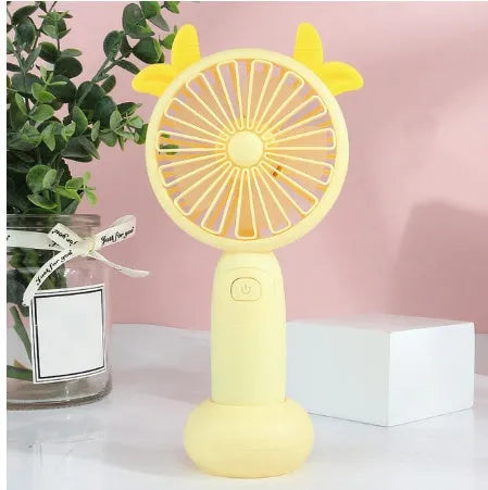 Blue hand-held USB charging mini fan with plastic blades on a white background.