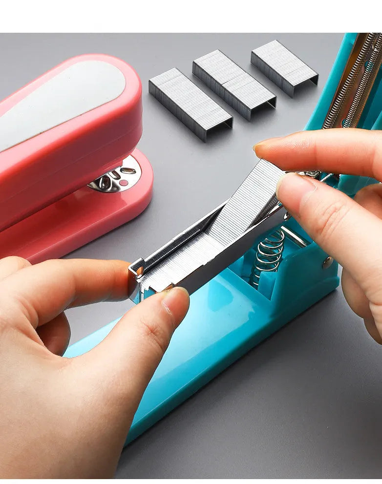 Black rotatable student stapler showing 360-degree rotation and centre seam binding function