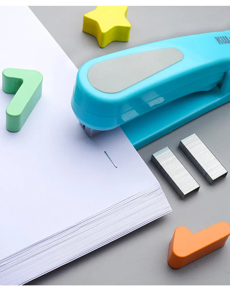 Black rotatable stapler with 360-degree rotating head on a desk next to stacked A4 paper.