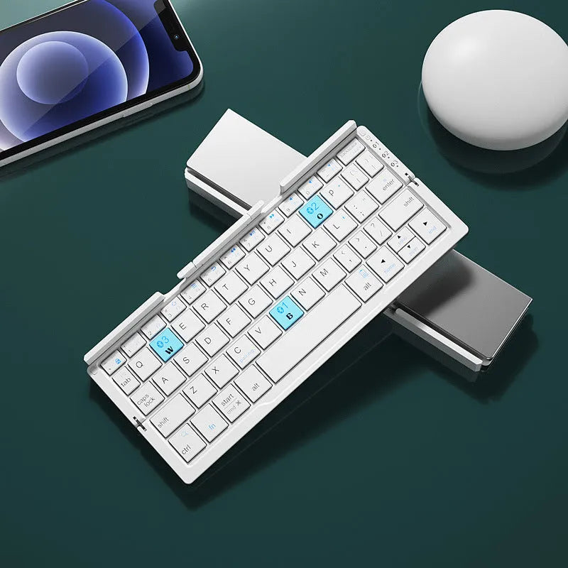 Silver white folding Bluetooth keyboard open with phone in stand next to closed black grey version