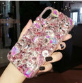 Clear rhinestone sparkle phone case for iPhone on a table, showing soft edges and model-specific fit.
