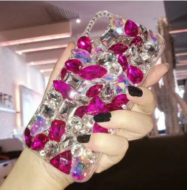 Clear rhinestone sparkle phone case for iPhone on a table, showing soft edges and model-specific fit.