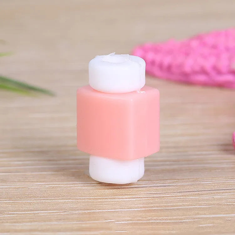 Plastic cable protective sleeve in pure colour, wrapped around a phone data cable to prevent breakage
