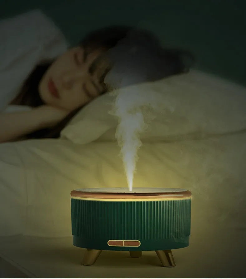 Green fashion electric oil humidifier 500ml with remote control on a table