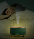 Green fashion electric oil humidifier 500ml with remote control on a table