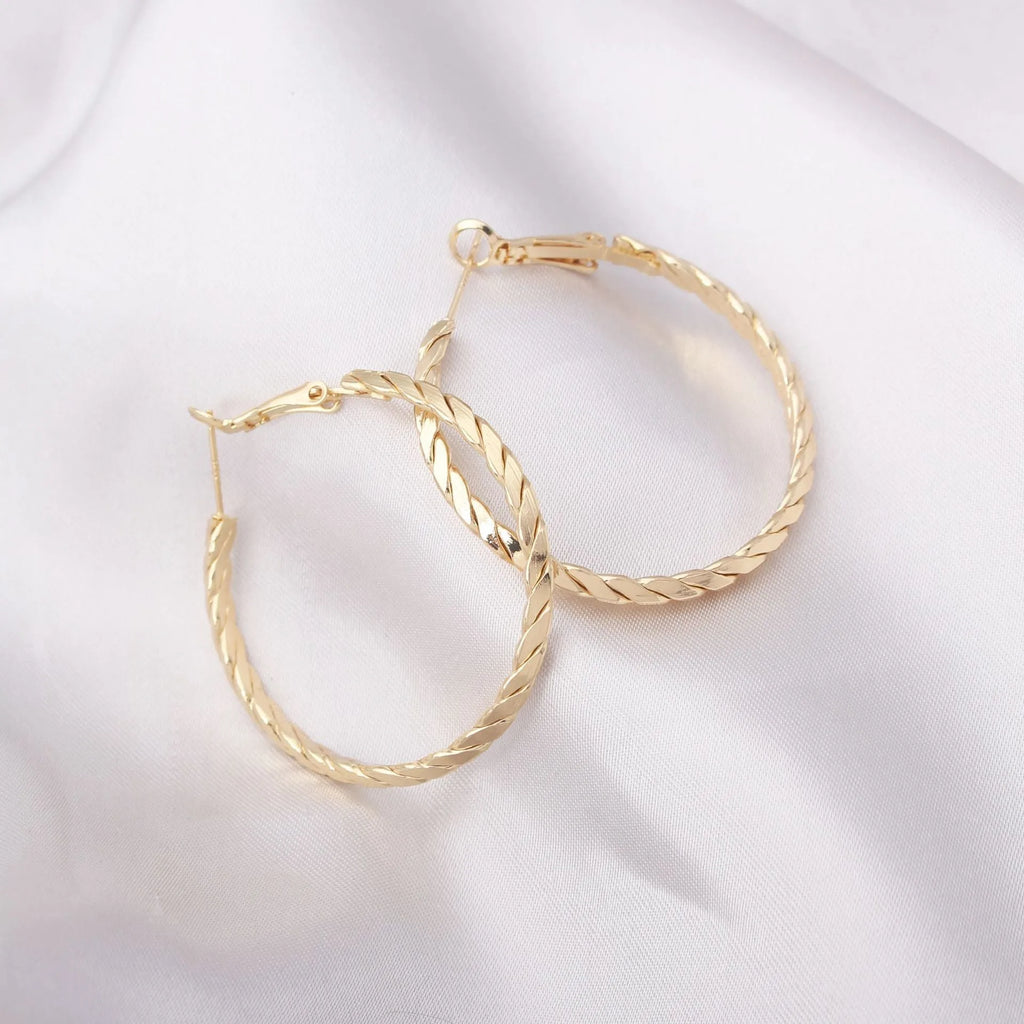 Geometric metal earring for women with electroplated finish, shown in Golden or Silver colour option