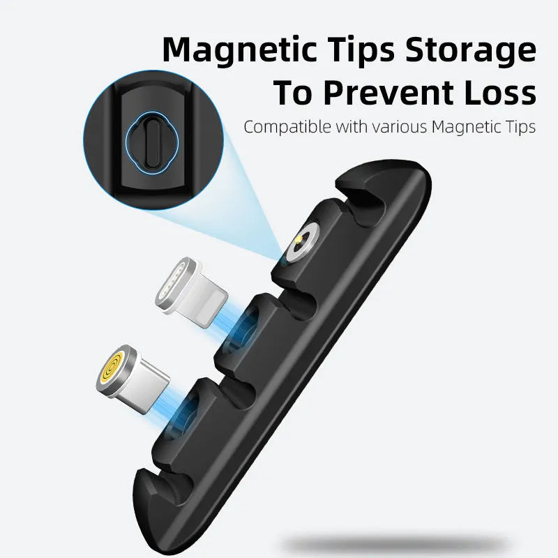 Black soft plastic desktop magnetic charging cable organiser on a desk.