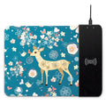 Colourful cartoon design wireless charging mouse pad with RGB lighting on a desk