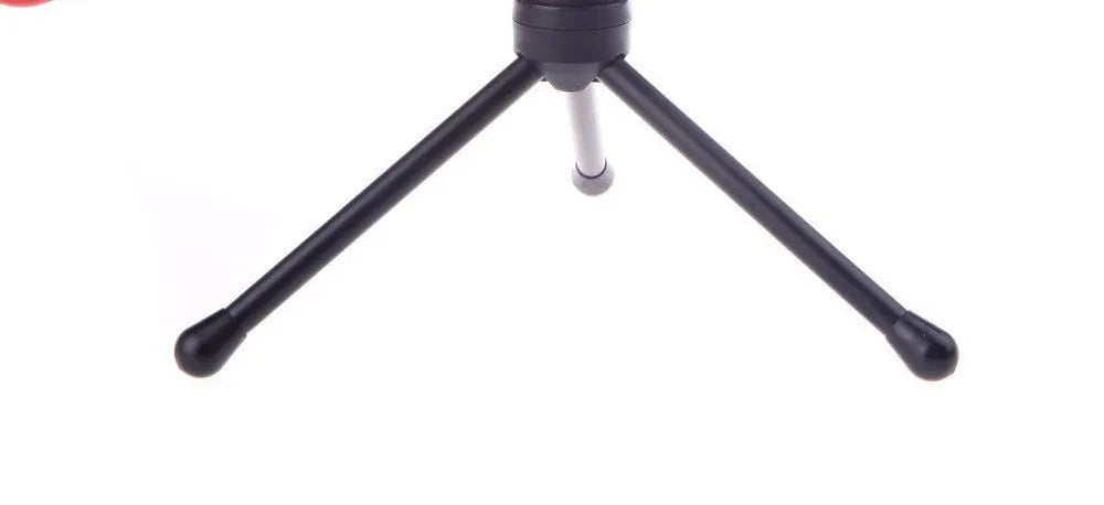 Black wired PC microphone with flexible gooseneck and metal clip on a computer monitor, showing 3.5mm plug.