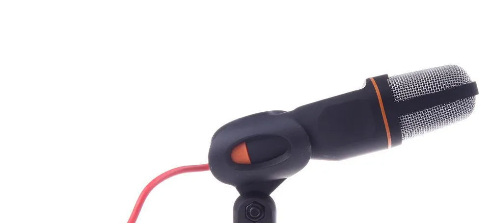 Black wired PC microphone with flexible gooseneck and metal clip on a computer monitor, showing 3.5mm plug.