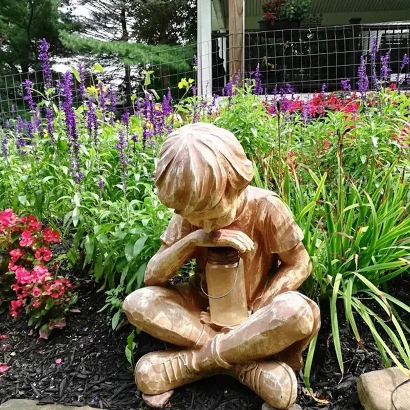 Brown natural resin tabletop statue of young boy in garden setting for indoor decoration