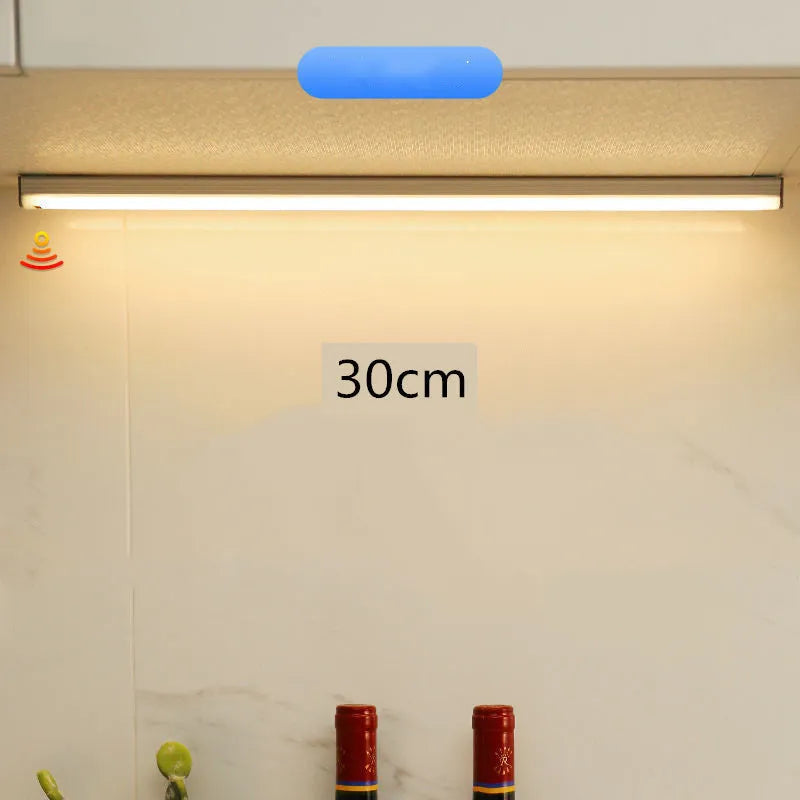 Rechargeable hand-scan activated LED strip light with magnetic mounting for cabinet interiors