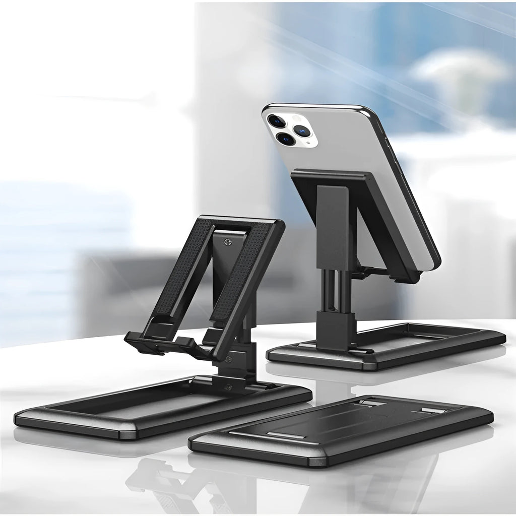 Retractable folding mobile phone desktop stand in black, shown extended in use and collapsed flat.