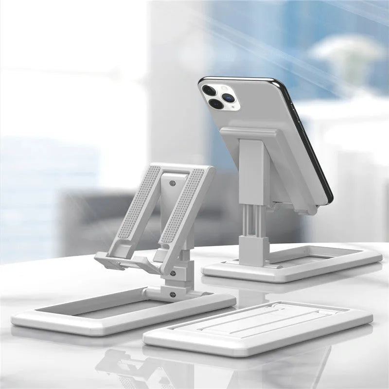 Retractable folding mobile phone desktop stand in black, shown extended in use and collapsed flat.