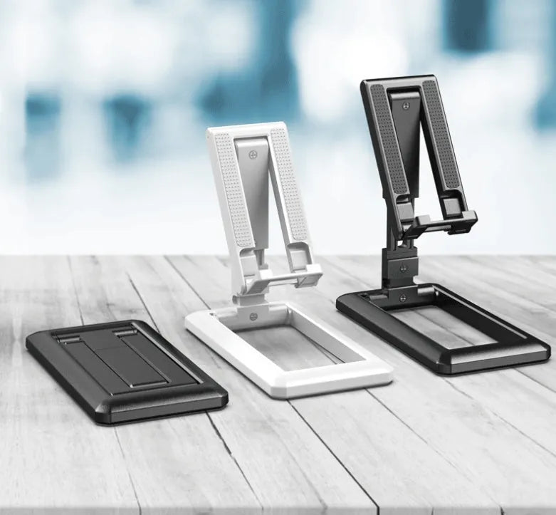 Retractable folding mobile phone desktop stand in black, shown extended in use and collapsed flat.