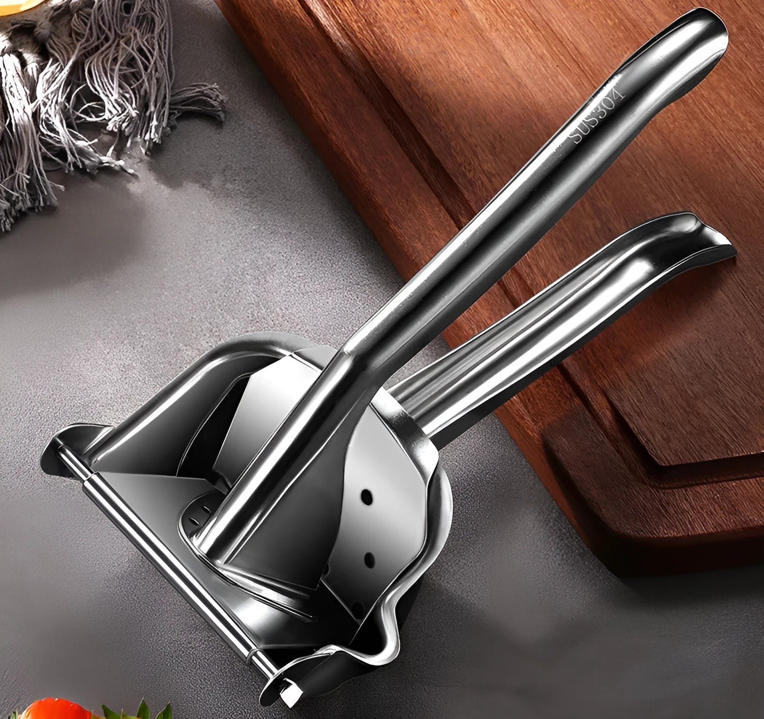 304 stainless steel manual juicer with porous filter and triangular juice outlet on kitchen counter
