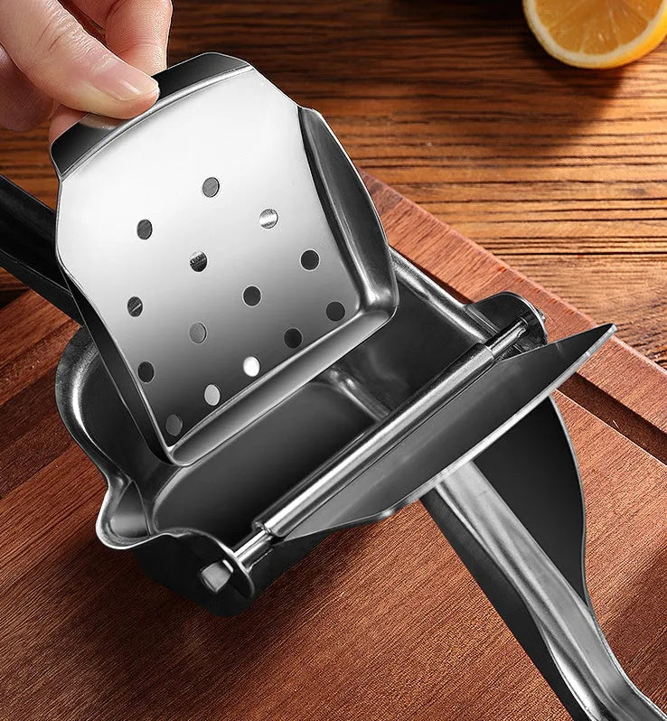 304 stainless steel manual juicer with porous filter and triangular juice outlet on kitchen counter