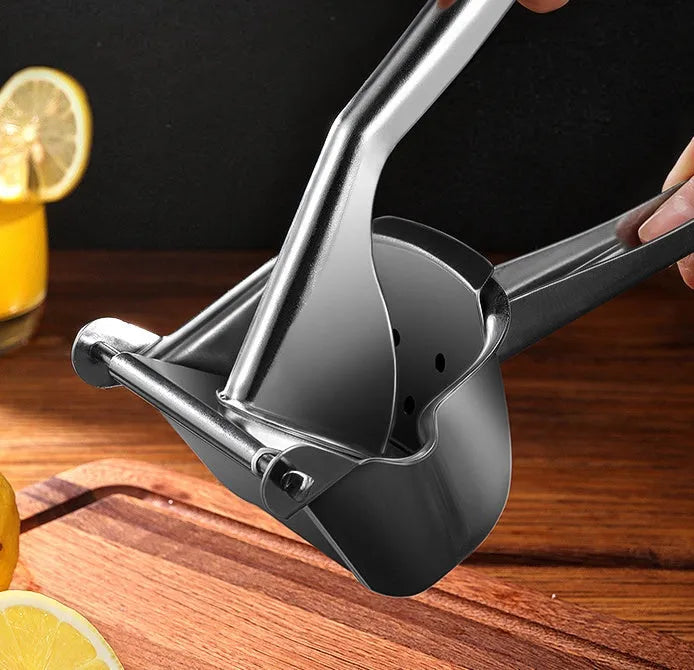 304 stainless steel manual juicer with porous filter and triangular juice outlet on kitchen counter