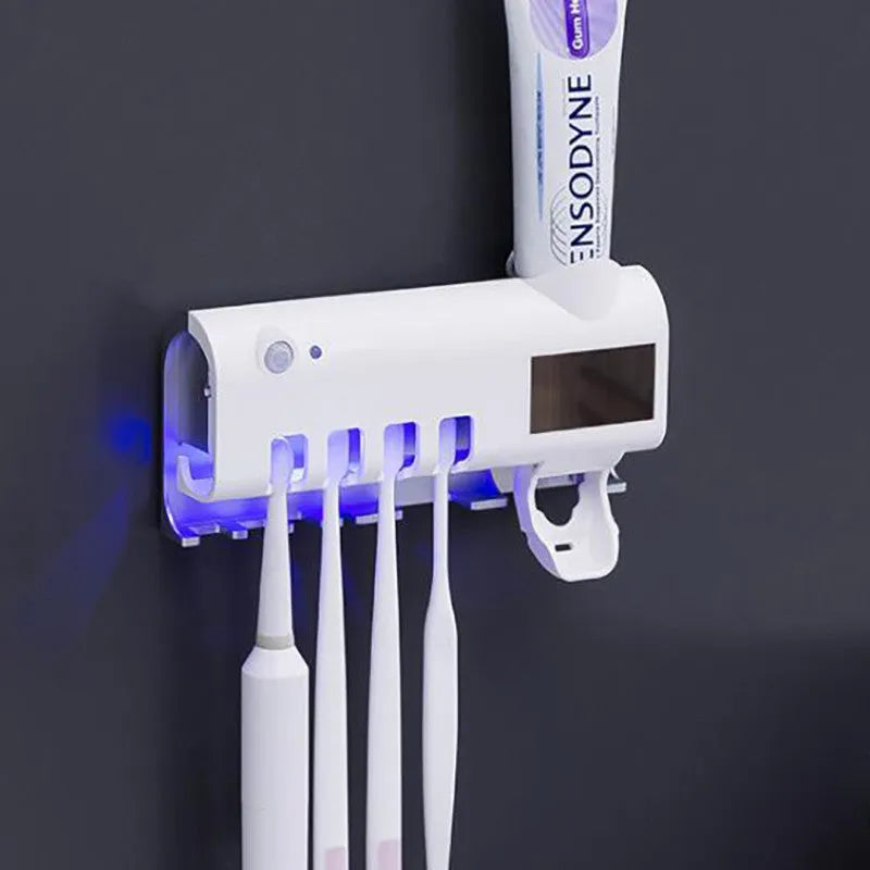 Black intelligent UV toothbrush sterilizer with automatic toothpaste squeezer mounted on a wall