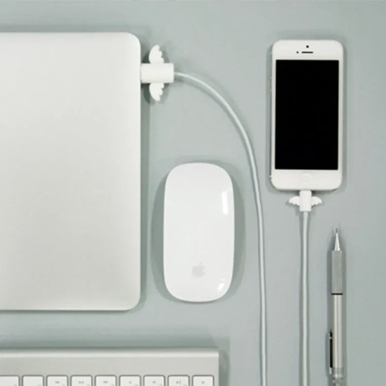 White and black silicone cable protective covers shown next to a mobile phone charging cable