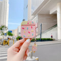 Pink cartoon ice cream design silicone protective case for Apple AirPods with a pendant.