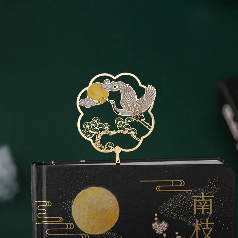 Chinese-style calligraphy gift set featuring a metal-sheathed feather pen, notebook, and collections of feather nibs.