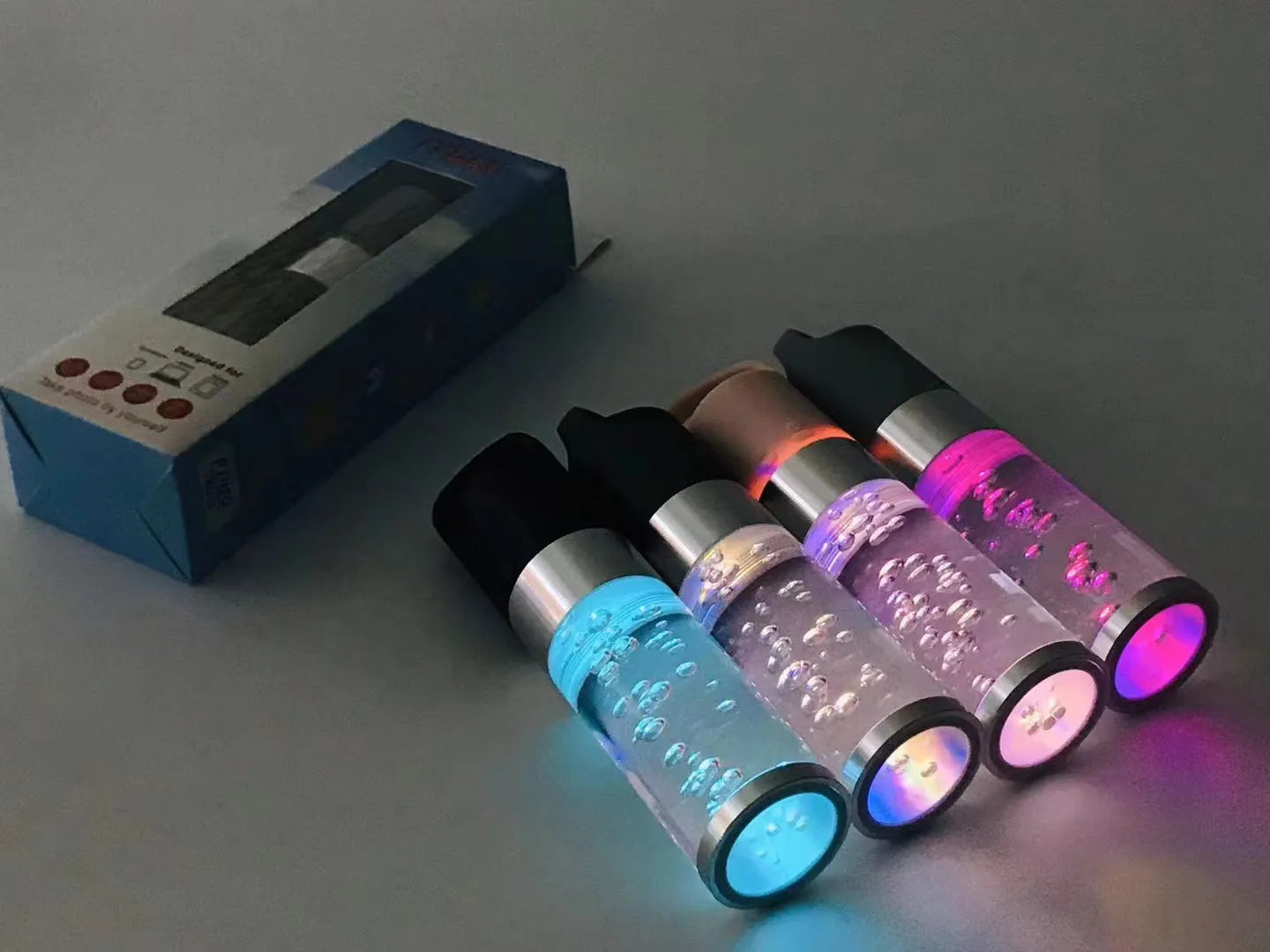 Colourful cartoon-design Bluetooth speaker with crystal lights in pink, black, silver grey, or green.