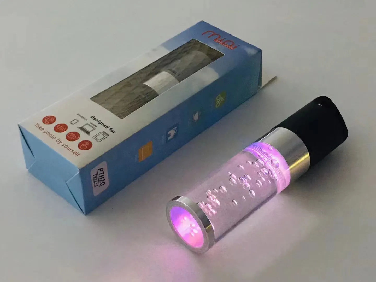 Pink cartoon-themed portable Bluetooth speaker with colourful crystal lights.