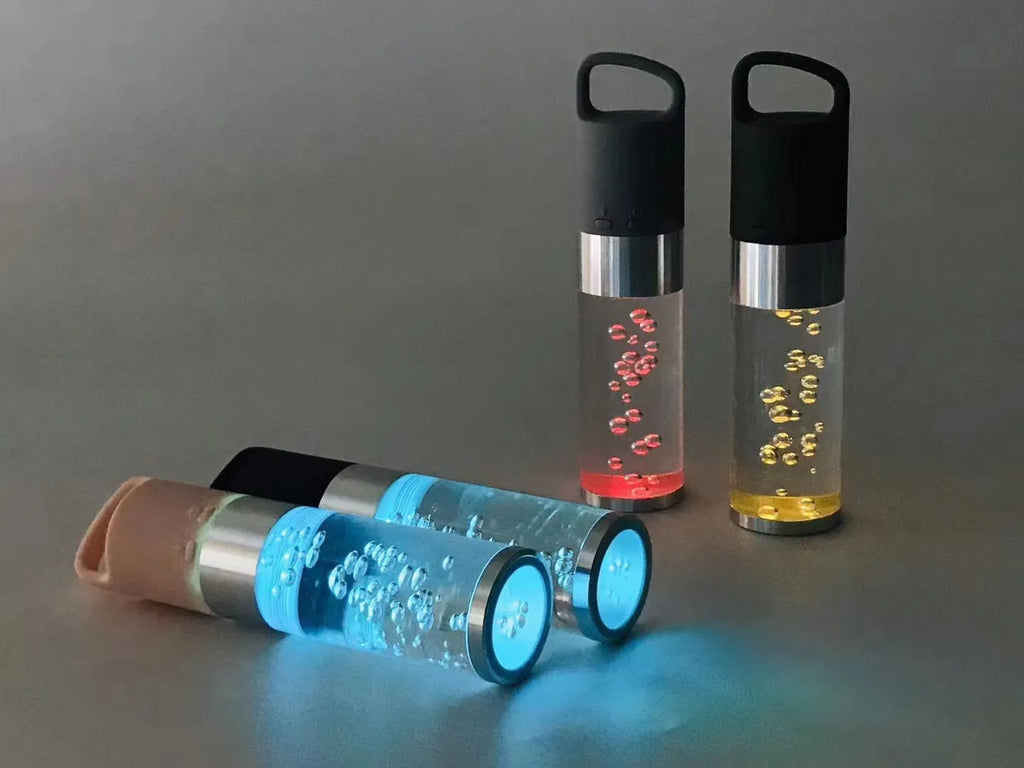 Colourful cartoon-design Bluetooth speaker with crystal lights in pink, black, silver grey, or green.