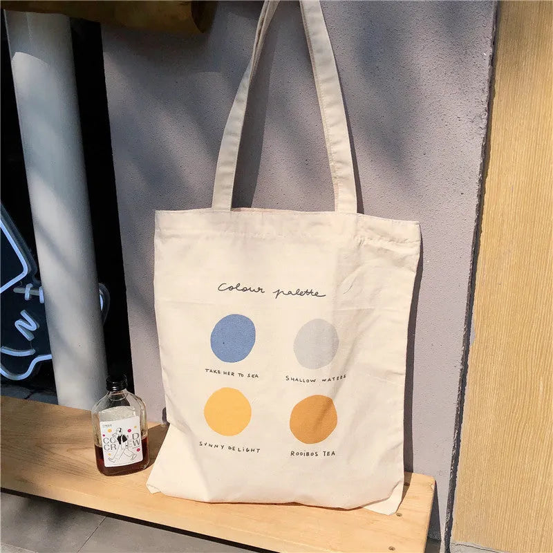 Women's medium canvas tote bag with zipper closure and geometric pattern in light pink