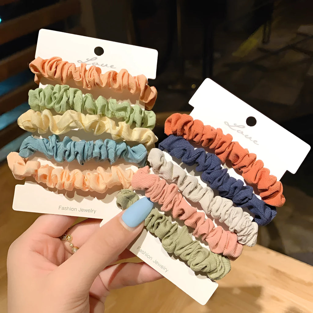 Assortment of children's small intestine hair rings and a large intestine head rope in autumn colours.
