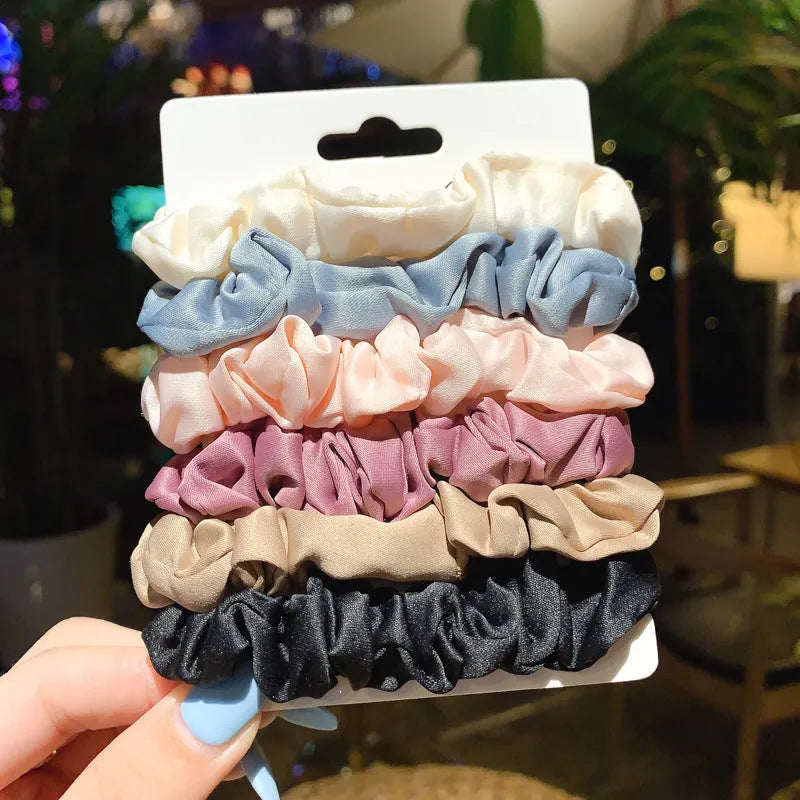 Assorted children's hair rings and head ropes in autumn colours and macaron pastels.