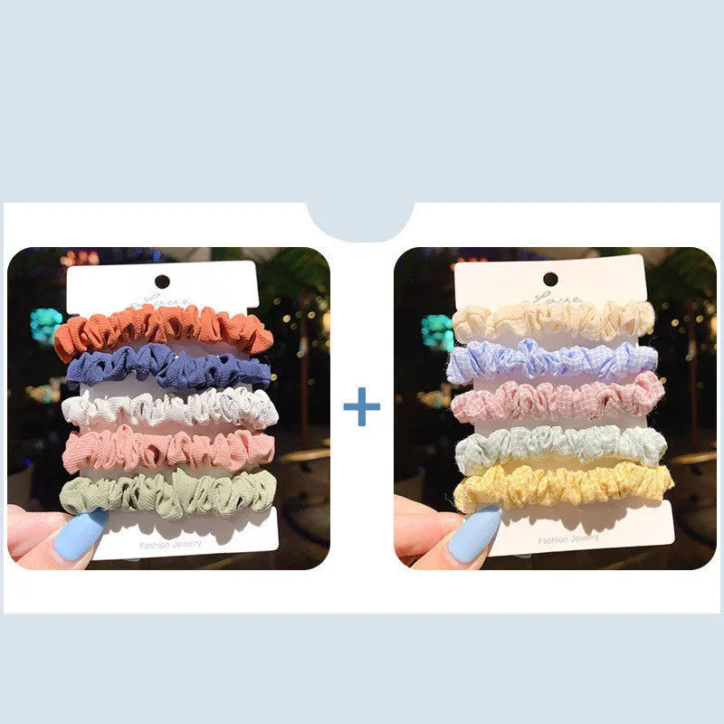 Assorted children's hair rings and head ropes in autumn colours and macaron pastels.