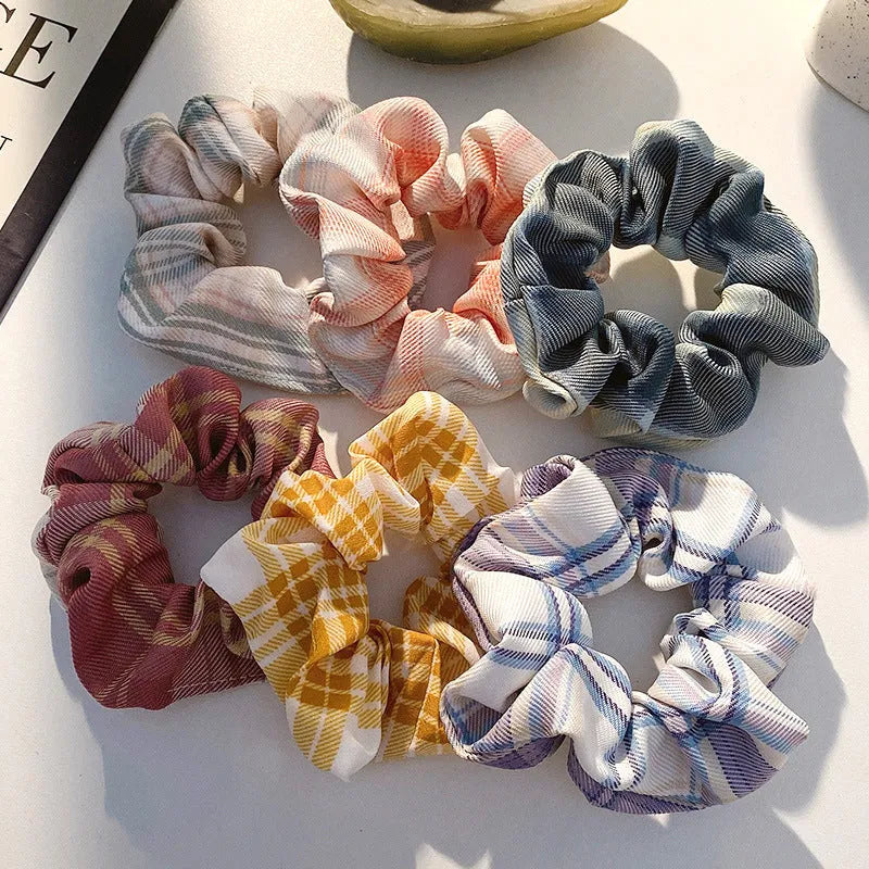Assortment of children's small intestine hair rings and a large intestine head rope in autumn colours.