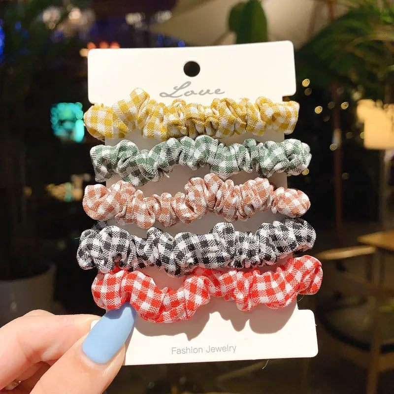 Assortment of children's small intestine hair rings and a large intestine head rope in autumn colours.