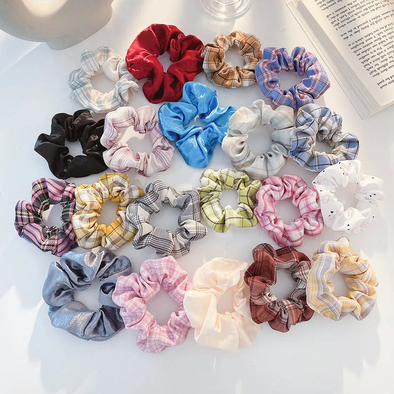 Assorted children's hair rings and head ropes in autumn colours and macaron pastels.
