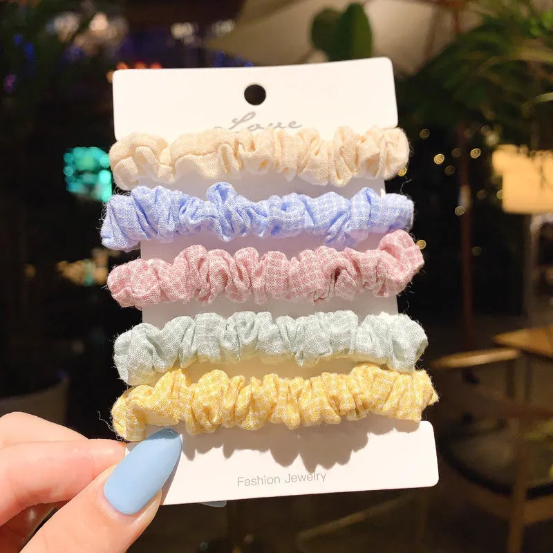 Assortment of children's small intestine hair rings and a large intestine head rope in autumn colours.